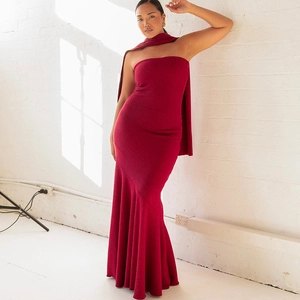 Detail of elegant dark red off-shoulder midi dress with back drape and mermaid hemline