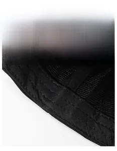Detail of breathable mesh fabric and reinforced moisture-wicking sweatband on black baseball cap
