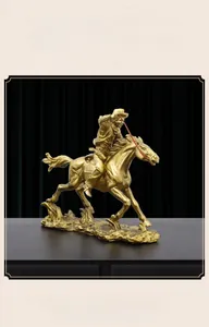 Detailed close-up of a vintage bronze-finished horse rider statue with dynamic muscle detail