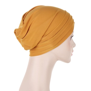 Detail of mustard yellow headscarf with layered pleated design for women