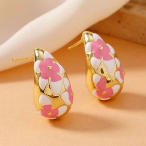 Vintage gold teardrop earrings with pink floral enamel for women in a retro punk style