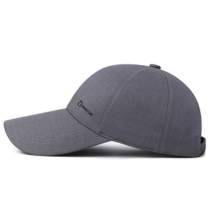 Dark grey long brim baseball cap with Heroism side logo and adjustable strap