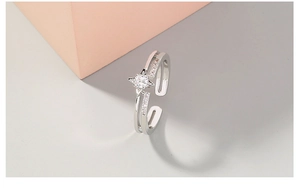 Detailed close-up of a silver adjustable star ring with shimmering zircon stones