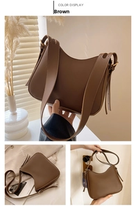 Detail of a brown crescent-shaped PU shoulder bag with adjustable strap and golden buckle