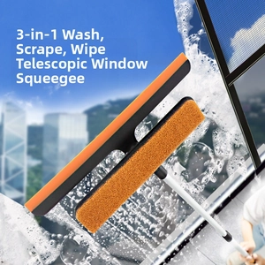 Close-up of 3-in-1 window cleaner with orange sponge and squeegee on soapy glass