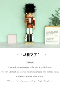Detail of Nutcracker soldier featuring red sequin uniform and golden scepter on desk