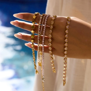 Gold plated titanium steel bracelets featuring heart zircons and star charms for women