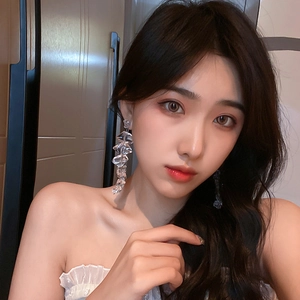Elegant long acrylic irregular ice cube drop earrings for women worn by a model