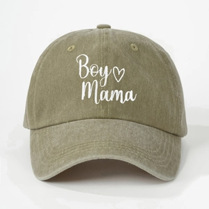 Detail of white Boy Mama embroidery with heart on khaki green washed cotton baseball cap