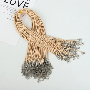 Detail of cream wax cord necklaces with silver lobster clasps and extension chains