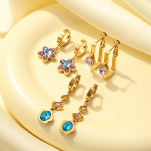 Three pairs of gold stainless steel earrings with colorful star and flower zircon charms