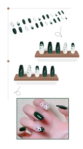 Detail of green tea floral press-on nails in long ballerina shape with 3D camellia design