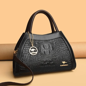 Classic black crocodile pattern handbag with brown handles and golden kangaroo charm