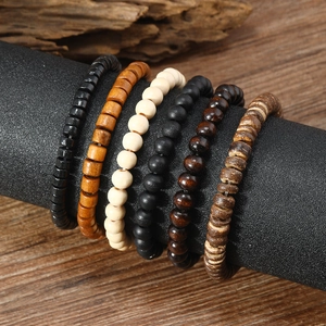 Set of 6 vintage wooden and coconut shell beaded bracelets with natural wood grain textures