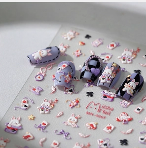Detailed relief nail stickers featuring Alice in Wonderland motifs like rabbits and clocks
