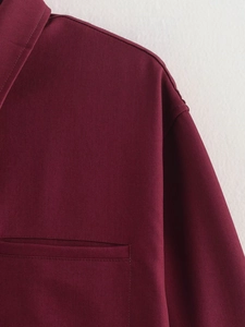 Macro view of dark burgundy twill shirt featuring shoulder seams and chest pocket detail