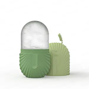 Detail of green facial ice roller with seashell texture and max water level indicator