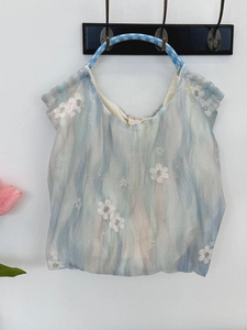 Embroidered floral tulle handbag with blue and pink gradient design and woven handles