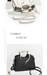 Detail view of cat ear metal handles and stitching on minimalist PU leather handbags