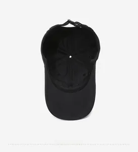 Detail view of the lightweight black baseball cap interior with adjustable buckle strap