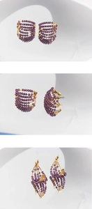 Detail of handmade purple crystal beads on multi-layer gold-plated C-shaped hoop earrings