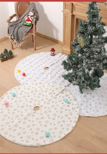 Detailed view of white plush 48 inch Christmas tree skirts with gold and silver snowflake sequins