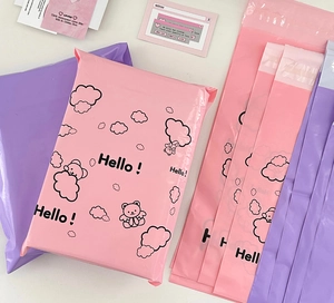 Close-up of pink and purple cartoon bear waterproof poly mailers for cute parcel packaging