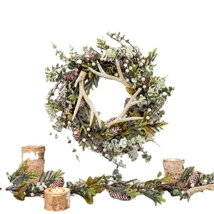 Christmas wreath and garland set with pine cones, white berries, and wooden candle holders