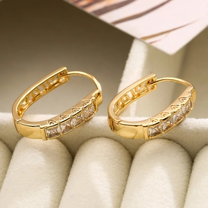 Irregular oval 18K gold plated hoop earrings with zircon stones on velvet box