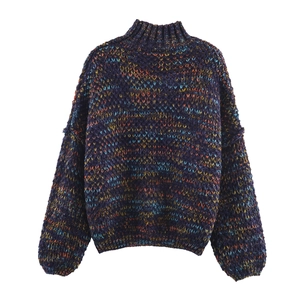 Detailed macro shot of multicolored melange knit texture on a high neck sweater