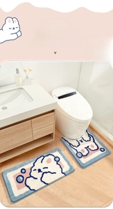 Detail view of thickened plush rabbit pattern bath mat and U-shaped toilet rug set