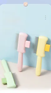 Detailed view of self-cleaning pet brushes in pink yellow and green with metal teeth