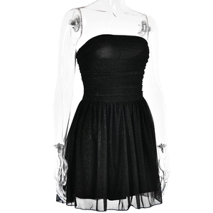 Close-up of black glitter mesh fabric on a sexy strapless party mini dress for women