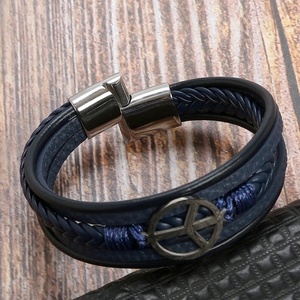 Macro view of blue multi-layer leather bracelet with silver magnetic clasp and peace sign