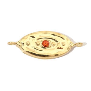 Detailed view of golden hammered oval pendant with orange gem and double side loops