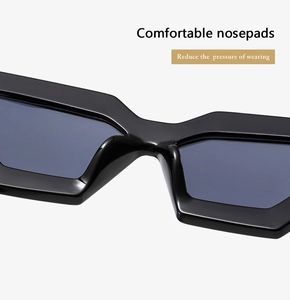Detail of comfortable integrated nosepads on black polygonal sunglasses to reduce pressure