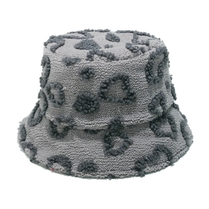 Close-up of grey leopard print faux shearling bucket hat texture and plush fuzzy material