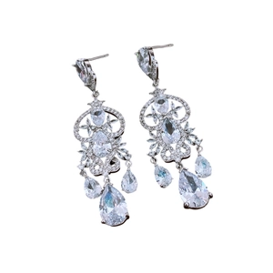 Vintage silver drop earrings with zircons and tassels on a clean white background