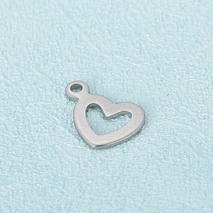 Single silver stainless steel hollow heart pendant charm on a light blue textured background