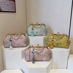 Elegant embroidered evening clutches with decorative tassels and kiss-lock metal frames