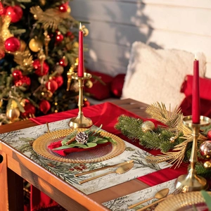 Vintage Christmas placemat with Santa Claus, pine branches, and berries on beige texture