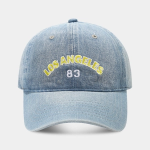 Close-up of Los Angeles 83 embroidery on washed blue denim baseball cap detail