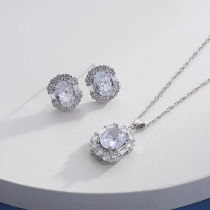 Elegant titanium steel necklace and earrings set with oval zircon gems in silver finish