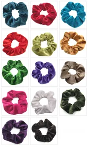 Detailed grid view of 14 various velvet scrunchies in vibrant colors with soft texture