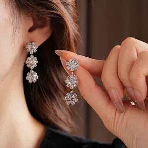 Elegant diamond sunflower tiered earrings with luxury rhodium plating and rhinestone tassels