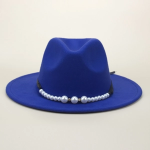 Detail view of royal blue fedora hat featuring elegant white pearl and rhinestone trim
