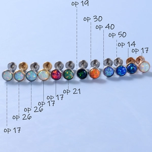 Opal lip and ear studs set in stainless steel with assorted vibrant opal stone colors