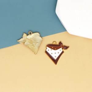 Macro detail of western cowboy bandana charm and textured golden shell pendant