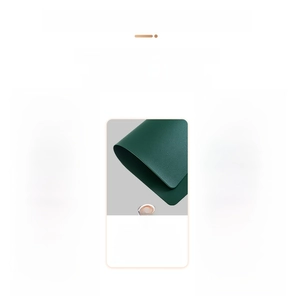 Detail of dark green 2mm thick faux leather placemat with heat-pressed edge and texture