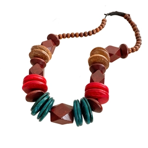 Bohemian handmade beaded necklace featuring multicolored wood and coconut shell geometric beads